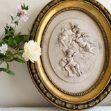 Pair of Vintage Oval Cherub Reliefs in Gilt Frame