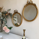 Pair of Antique French Oval Bow Mirrors