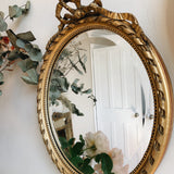 Pair of Antique French Oval Bow Mirrors